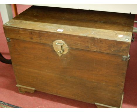 An Eastern hardwood hinge-top travelling trunk 