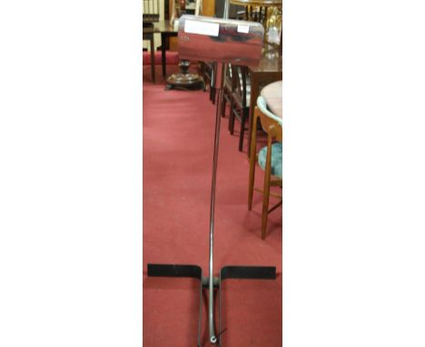 A 1960s probably Italian tubular chrome standard lamp, of lower curved form, having adjustable rotating integral shade, on bl