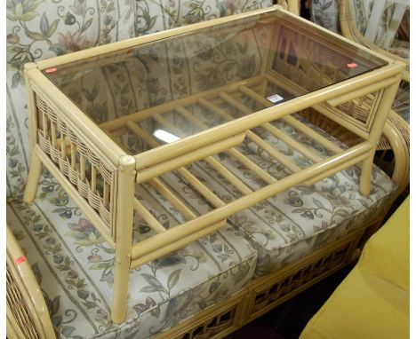 A contemporary bamboo conservatory suite comprising; two-seater sofa, pair of armchairs, and glass inset coffee table (4)