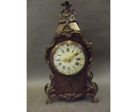 A C19th French Boule mantle clock with ormolu mounts and French platform movement, the enamel dial with Arabic and Roman nume