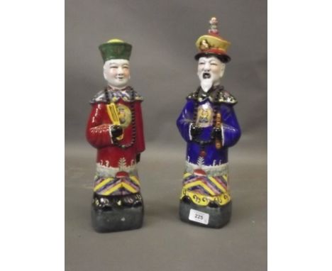 A pair of Chinese ceramic figures of courtly gentlemen with bright glazed and gilt decoration, impressed seal mark to base, 1