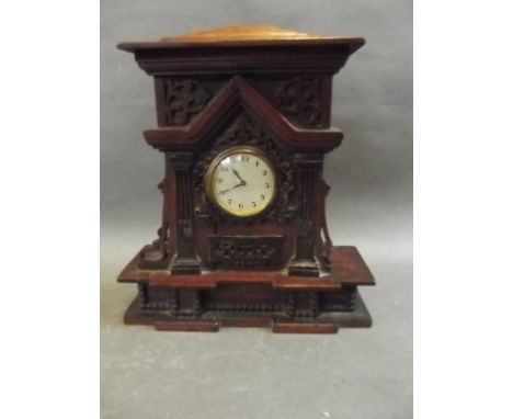 A Folk Art architectural wood cased mantle clock with applied fretwork decoration, 10½" high 