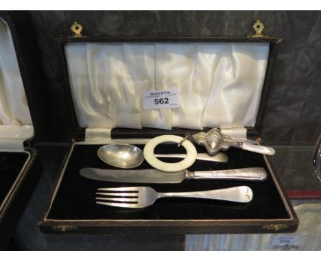 A child's cased silver knife, fork and spoon and a child's teether