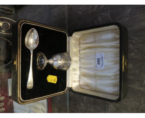 A cased child's silver egg cup and spoon
