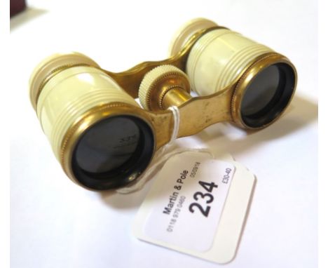 A pair of 1900/1910 opera glasses, mounted in ivory together with a brass Corinthian column style oil lamp, converted to elec