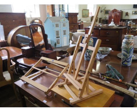 A Rowney table top artist's easel, another, and a box of artist's materials