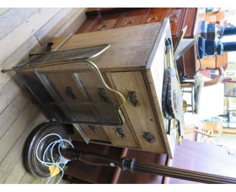 An oak chest of drawers with three drawers on bracket feet 67cm wide and a reeded standard lamp (2)