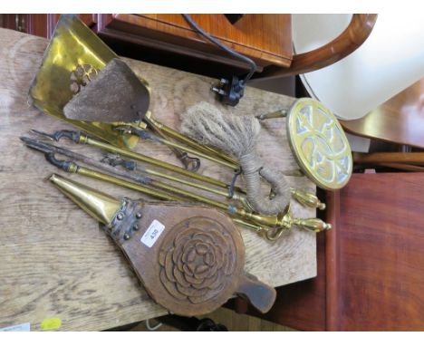 A set of brass fire irons, a trivet, a pair of bellows and a firescreen