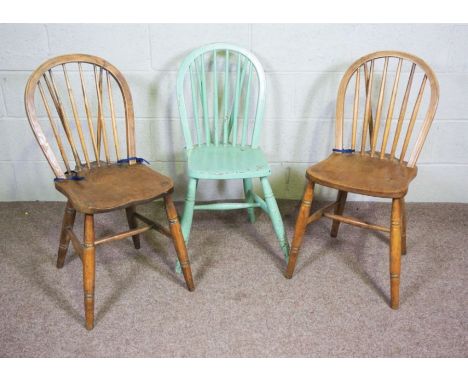 Three provincial elm and ash Kitchen hoop backed chairs, with stick backs and turned legs, one later painted, one stamped to 