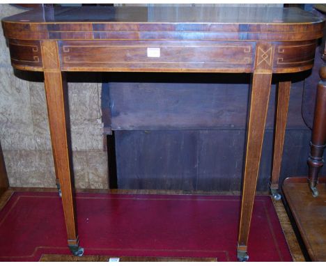 A late George III rosewood and satinwood crossbanded card table, having a D-shaped fold-over top above a baize lined playing 