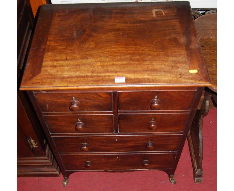A 19th century mahogany hinge top chest commode, with twin upper cupboard doors over two dummy drawers, width 61cm