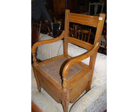 An Edwardian satin walnut commode chair, width 54cm