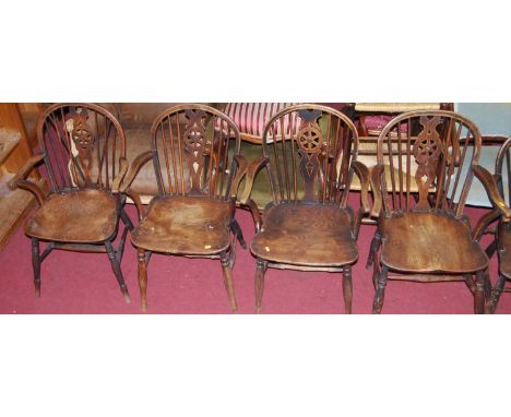 Six similar early 20th century elm wheel and stick back elbow chairs