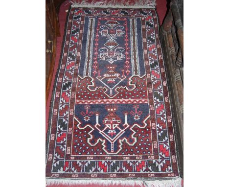 A Turkish woollen prayer rug, 150 x 78cm, together with a Persian style machine woven red ground small runner, 137 x 71cm (2)