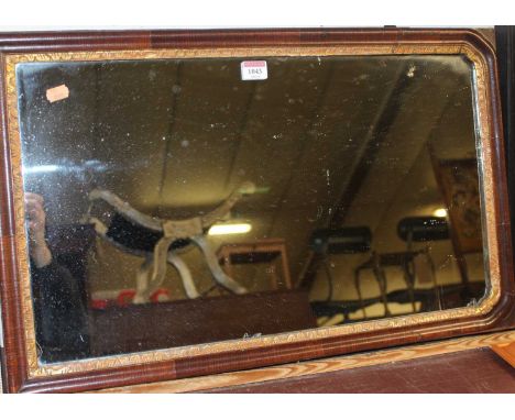 An 18th century walnut and parcel gilt framed wall mirror (some losses), 67 x 42cm