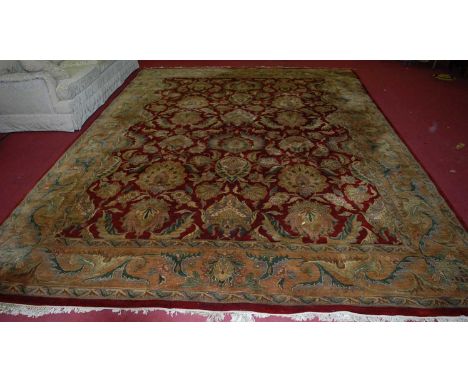 A large Chinese Superwash red ground carpet with all over floral stylised ground, 420 x 302cm