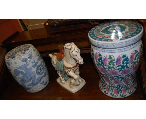 A contemporary Chinese glazed stoneware barrel seat, one other similar, and a Tang style horse (3)Condition report: Both seat