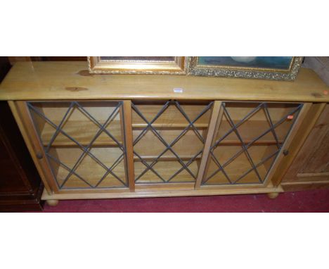 A light elm and lead glazed low bookcase, width 137cm