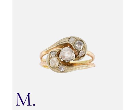 NO RESERVE. A Diamond Twist Ring in 18K yellow gold, set with an old cut diamond weighing approximately 0.45ct to the centre 