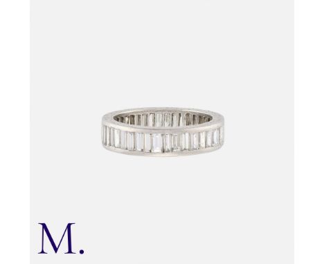 A Baguette Diamond Eternity Ring in platinum, set all around with baguette cut diamonds totalling approximately 3.00cts. Unma