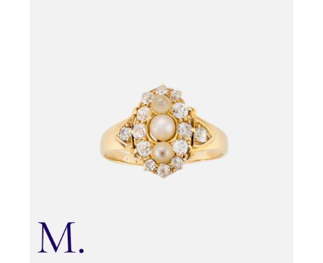 A Pearl And Diamond Ring in yellow gold, the navette form set to the centre with a trio of pearls surrounded by a border of o