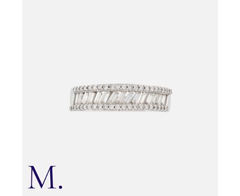 A Diamond Ring in 18K white gold, set with round and baguette-cut diamonds weighing approximately 0.55ct. Hallmarked for 18ct