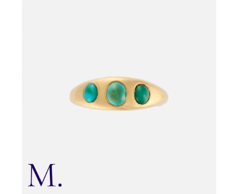 A Turquoise Gypsy Ring in 18k yellow gold, set with three cabochon turquoise. British hallmark for 18 carat gold.Size: M1/2We