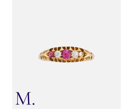 A Ruby And Diamond Ring in 18k yellow gold, set with round cut rubies and round cut diamonds, one stone deficient. Hallmarked
