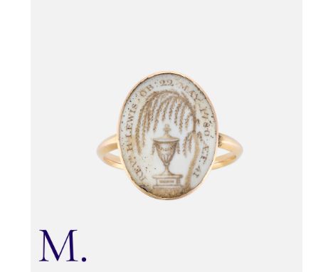 A Georgian Memorial Ring (1780) in yellow gold, depicting an urn under a weeping willow tree, with the words "REV'D H LEWIS O