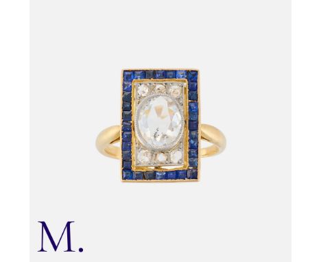 A Sapphire and Diamond Ring in 18K yellow gold, with a rose cut diamond to the centre (approx. 7 x 5.5 x 1.5mm) with calibrat