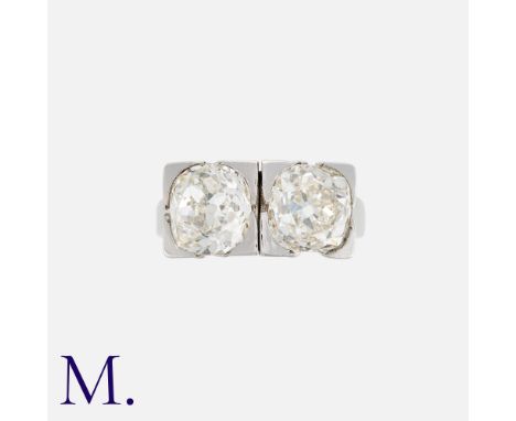 An Art Deco 2-Stone Diamond Ring in 18k white gold and platinum. The diamonds weighing approx. 2.0ct each. French marks for 1