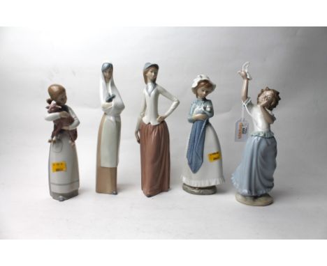 Five figurines, four Nao, one Lladro 