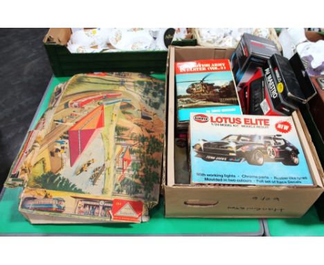 Tinplate West German clockwork tram system with part box and box of mixed games, books on The British Army in Ulster, game co
