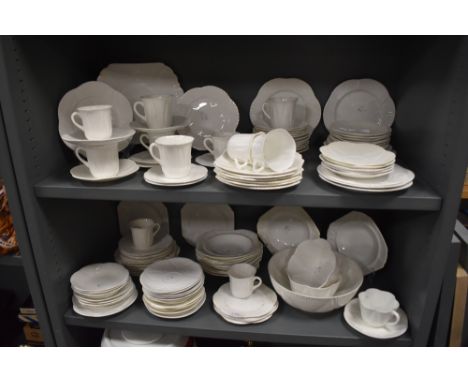 A large collection of Shelley dainty white including cups and saucers, fruit bowl, bowls, plates and more.