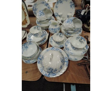 A part tea service in porcelain having blue transfer print and swirl design