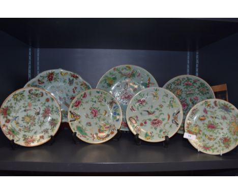 A collection of seven hard paste Chinese plates in Cantonese designs painted with butterfly bird and floral designs
Condition