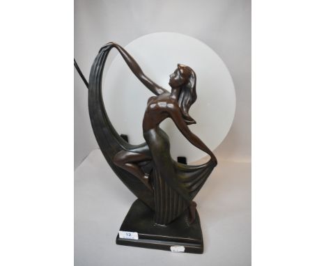 A modern art deco design lamp with dancing lady figure