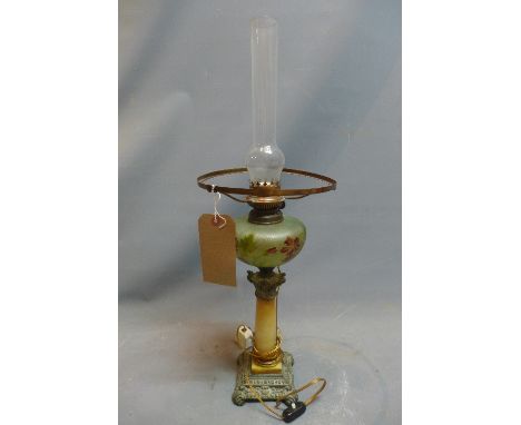 A late 19th/early 20th Century Portuguese oil lamp with alabaster column and hand painted green glass shade. 