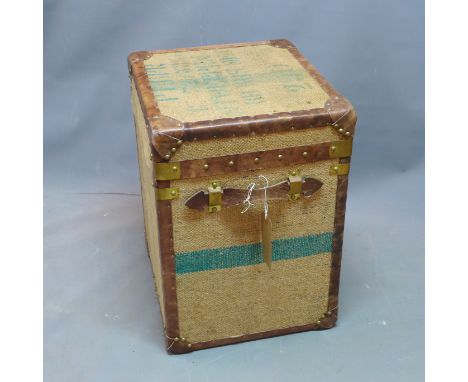 A contemporary trunk with hessian upholstery 