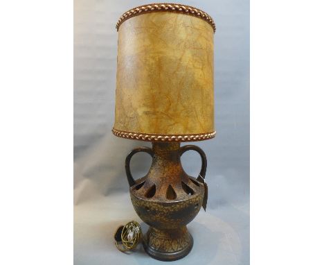 A 1970s large West German pottery lamp with original raw hide shade. 