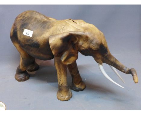 A ceramic elephant, H:32cm L:60cm 