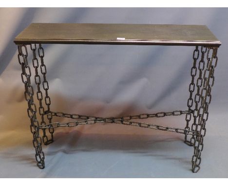 An industrial console table with bronzed top, raised on steel chainlink supports. H-83cm, W-101cm, D-31cm 