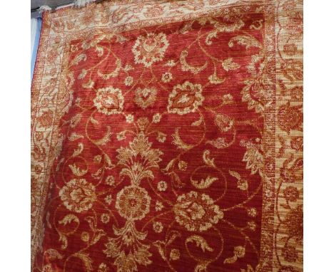 A Zeigler style carpet with central floral medallion on a red ground contained by borders. 230x160 