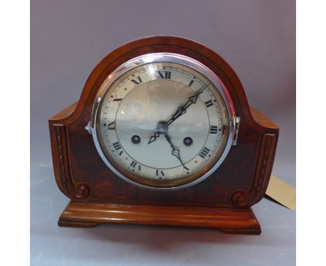 A mahogany and walnut cased 14 day mantel clock, made in Baden, the silvered dial with Roman numerals, chiming gong, H. 23cm 