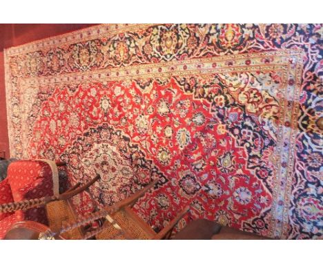 A fine central Persian Kashan carpet, 355cm X 250cm. Double pendant medallion on a rouge field with repeating shah abass span