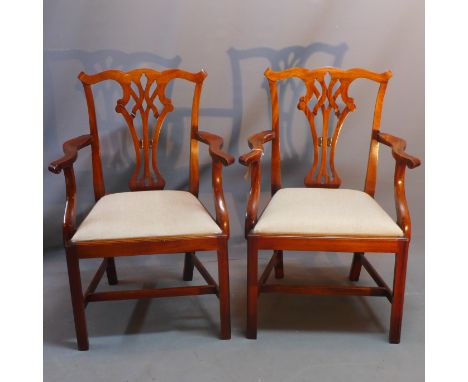 A set of ten chippendale style mahogany dining chairs to include two carvers. 