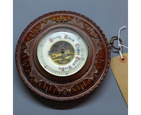 An early 20th century mahogany barometer 