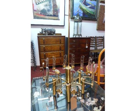 A Gaetano Sciolari style gilt metal chandelier decorated with glass sticks. 