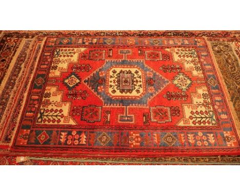 A fine North West Persian Nahawand rug, 198cm X 140cm. Central diamond jade medallion with repeating petal motifs on a terrac