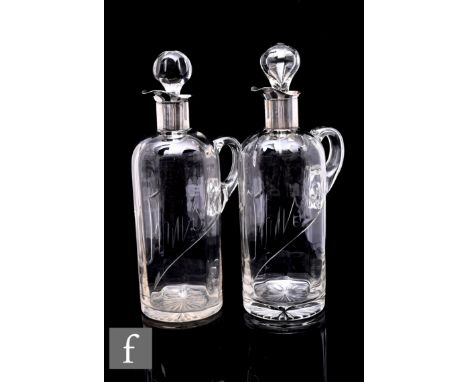 Stevens &amp; Williams - A pair of early 20th Century clear crystal glass decanters of shouldered cylindrical form with inter